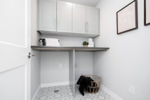 Laundry room with cabinetry at 102 Siskin Bay