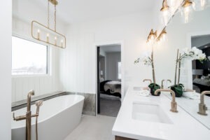 Ensuite with soaker tub and gold hardware at 323 Duchek Drive