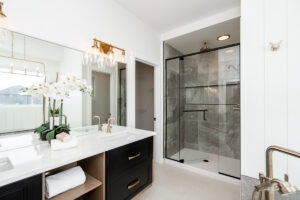 Ensuite with tiled shower and vanity at 323 Duchek Drive