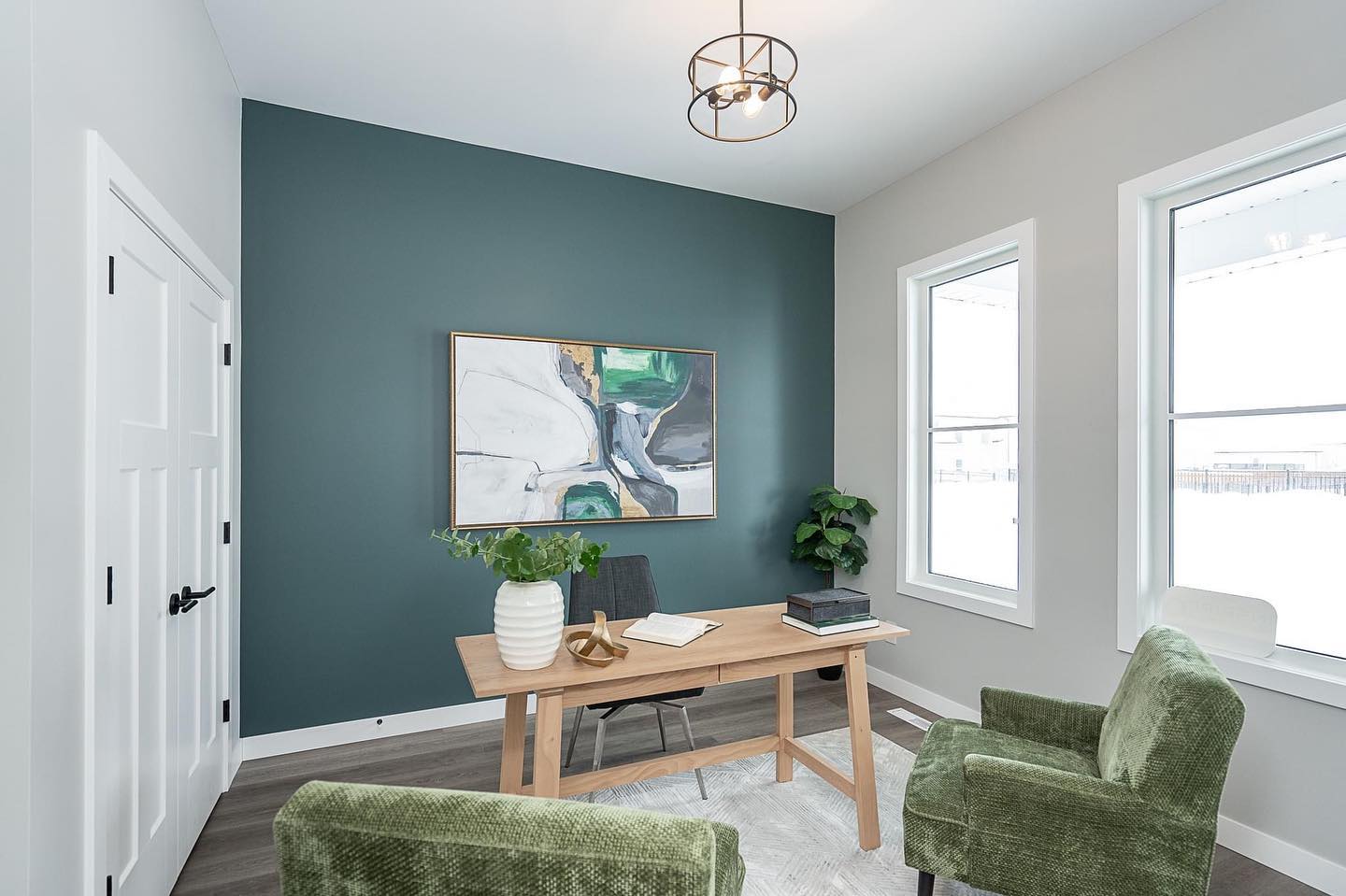 This main floor flex room makes for the perfect office/study space! The large windows add so much natural light and the custom painted feature wall brings life to the space. Pair it with some fun pieces to add personality. 

📍 111 Valley Brook Road, Bridgwater Trails
Immediate possession available - learn more through the link in our bio.